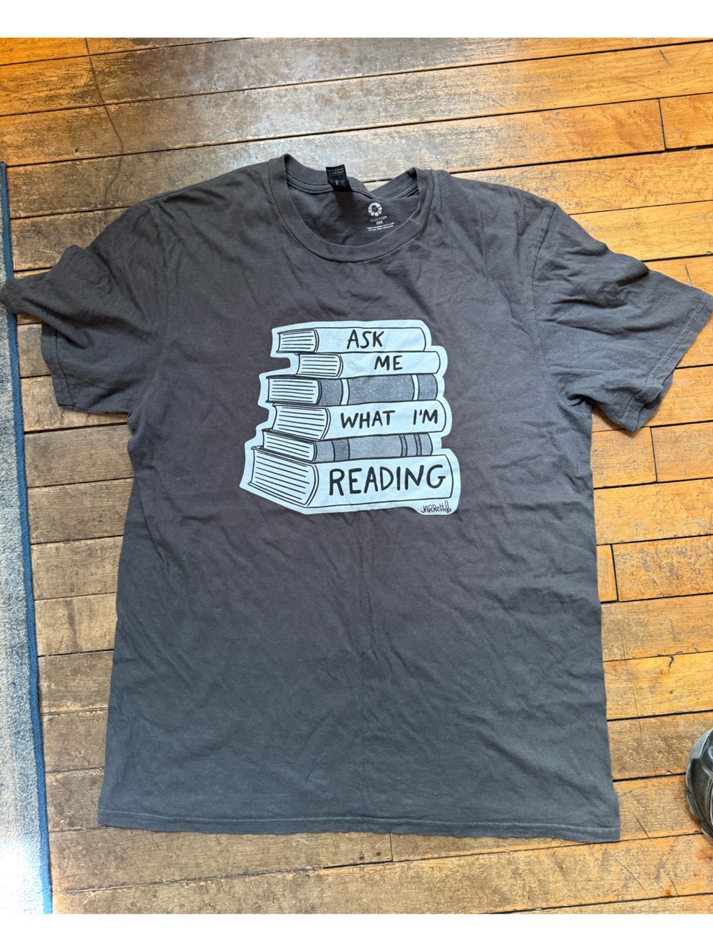 Unisex Size Medium “Ask Me What I’m Reading” T Shirt